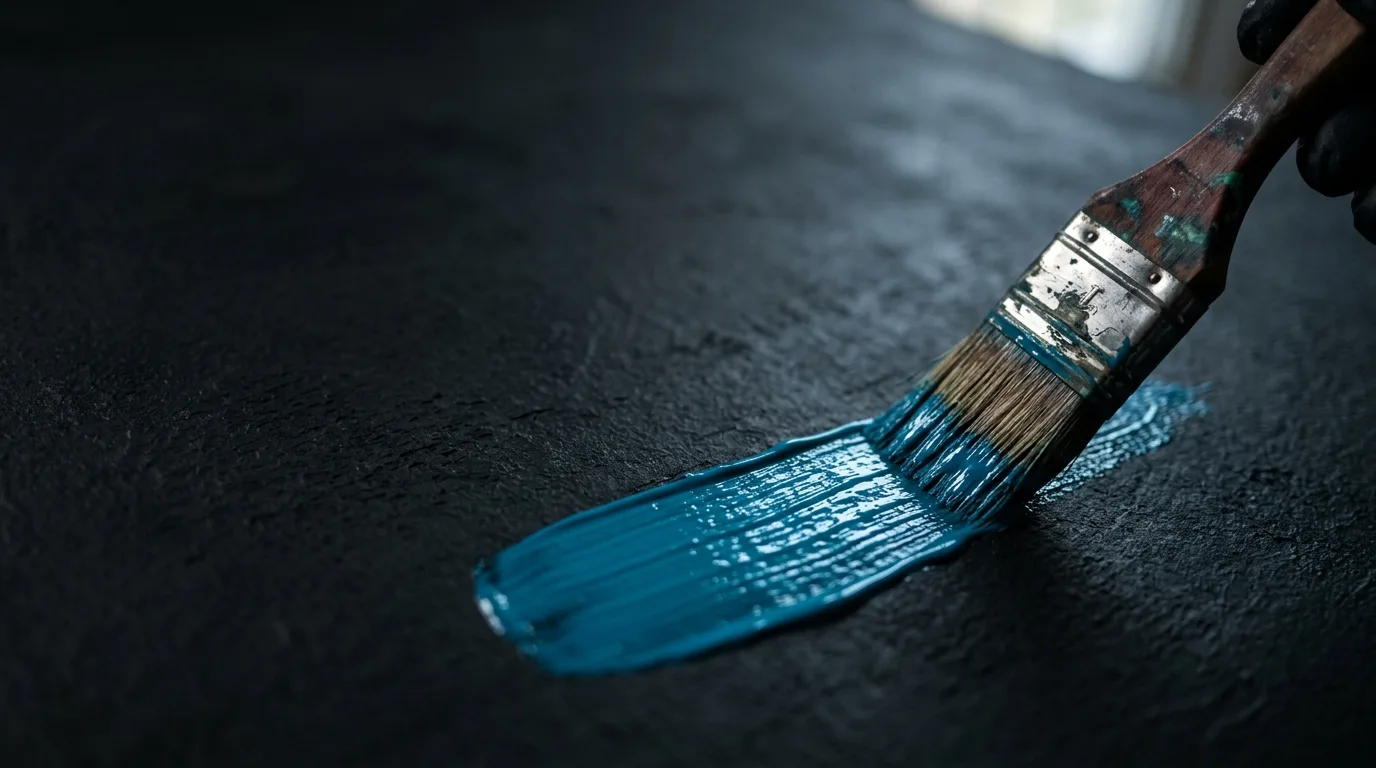 Paintbrush loaded with blue paint
